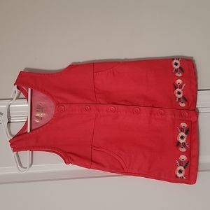 Cute red button dress with flowers along the bottom